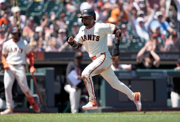 Luis Arraez #1 of the San Francisco Giants scores from third base on a throwing error from Austin Riley #27 of the Atlanta Braves in the bottom of the sixth inning at Oracle Park on June 28, 2026 in San Francisco, California. (Photo by Thearon W. Henderson/Getty Images)