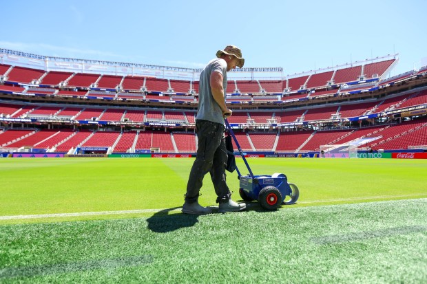 Matt Greiner, in his 16th year with the 49ers and his third as director of groundskeeping, chalks the field at the Francisco Bay Area Stadium in Santa Clara, Calif., on Wednesday, June 10, 2026. (Shae Hammond/Bay Area News Group)