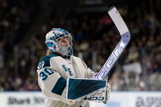 Seattle Torrent's Corinne Schroeder (30) waits for a face off against the Vancouver Goldeneyes during the first period of a PWHL hockey game in Vancouver, on Tuesday, April 14, 2026. (Ethan Cairns/The Canadian Press via AP)