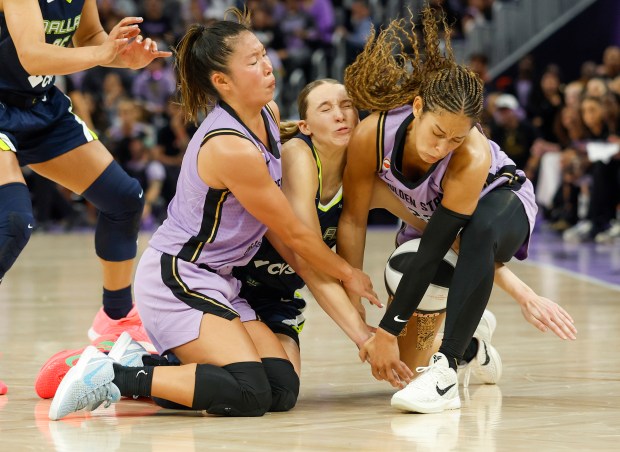 Golden State Valkyries' Kaitlyn Chen (2), Golden State Valkyries' Veronica Burton (22) and Dallas Wings' Paige Bueckers (5) collide while fighting for a loose ball in the fourth quarter at the Chase Center in San Francisco, Calif., on Wednesday, June 17, 2026. (Nhat V. Meyer/Bay Area News Group)
