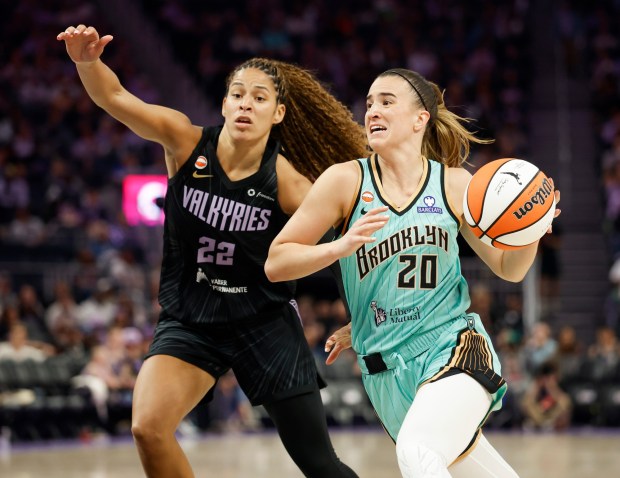 New York Liberty's Sabrina Ionescu (20) heads to the basket against Golden State Valkyries' Veronica Burton (22) in the third quarter at the Chase Center in San Francisco, Calif., on Sunday, June 28, 2026. (Nhat V. Meyer/Bay Area News Group)