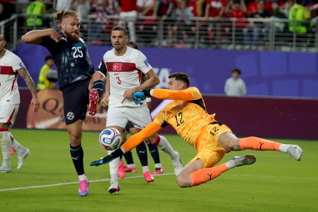 Paraguay Goalkeeper Orlando Gill (12) makes a save as teammate Paraguay's Isidro Pitta (25) avoid to kick him during the first half of a FIFA World Cup match against the Turkey at Levi's Stadium on Friday, June 19, 2026. (Ray Chavez/Bay Area News Group)