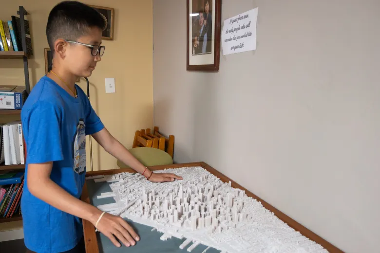 Kai Wang touches 3d printed board of San Francisco