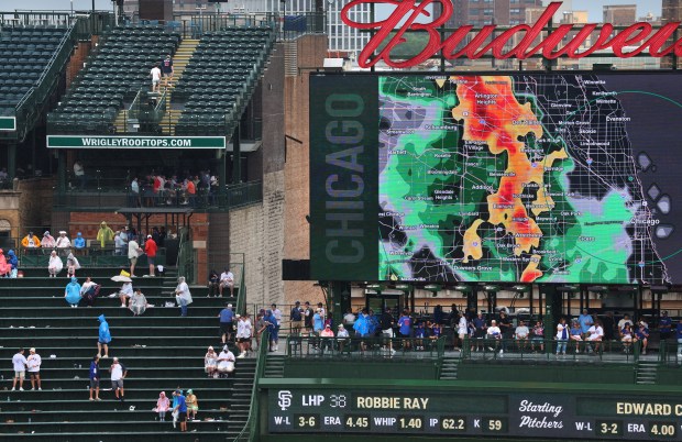 Local radar is shown on a big screen as Chicago Cubs fans wait out a rain delay before the scheduled start of a game between the Cubs and the San Francisco Giants at Wrigley Field in Chicago on June 5, 2026. (Chris Sweda/Chicago Tribune)