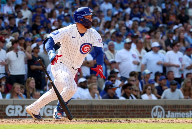 Cubs first baseman Michael Busch singles in the bottom of the 10th inning against the Giants on Saturday, June 6, 2026, at Wrigley Field. A fielding error allowed Dansby Swanson to score the winning run. (Chris Sweda/Chicago Tribune)