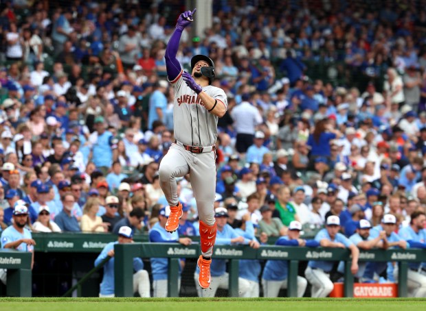 San Francisco Giants shortstop Willy Adames celebrates before crossing home plate after hitting a two-run home run in the first inning of a game against the Chicago Cubs at Wrigley Field in Chicago on June 5, 2026. (Chris Sweda/Chicago Tribune)