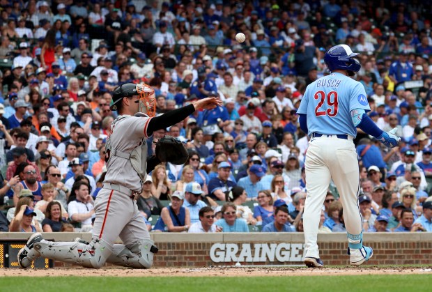 Chicago Cubs first baseman Michael Busch (29) walks to the dugout after striking out in the second inning of a game against the San Francisco Giants at Wrigley Field in Chicago on June 5, 2026. (Chris Sweda/Chicago Tribune)