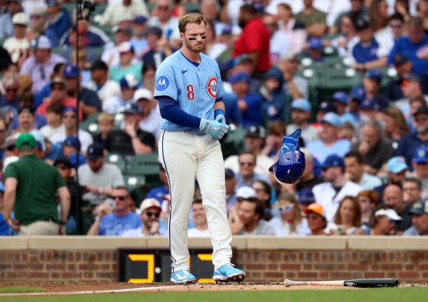 Chicago Cubs left fielder Ian Happ (8) tosses his helmet aside after striking out to end the third inning of a game against the San Francisco Giants at Wrigley Field in Chicago on June 5, 2026. (Chris Sweda/Chicago Tribune)