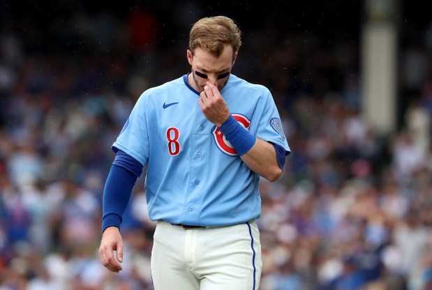 Chicago Cubs left fielder Ian Happ (8) walks on the infield after striking out to end the third inning of a game against the San Francisco Giants at Wrigley Field in Chicago on June 5, 2026. (Chris Sweda/Chicago Tribune)