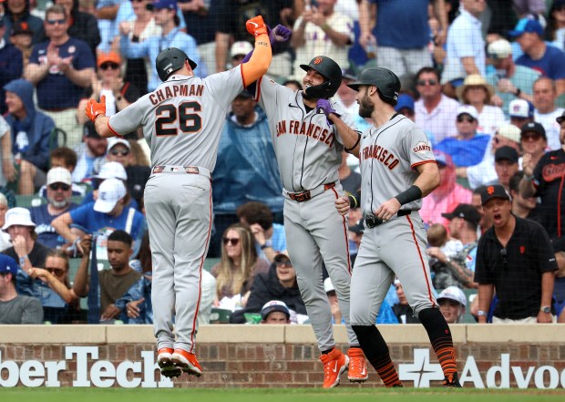 San Francisco Giants third baseman Matt Chapman is congratulated by his teammates after hitting a grand slam in the fourth inning of a game against the Chicago Cubs at Wrigley Field in Chicago on June 5, 2026. (Chris Sweda/Chicago Tribune)