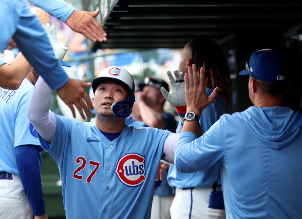 Chicago Cubs right fielder Seiya Suzuki is congratulated by his teammates after hitting a solo home run in the eighth inning of a game against the San Francisco Giants at Wrigley Field in Chicago on June 5, 2026. (Chris Sweda/Chicago Tribune)