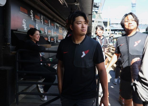 Injured White Sox first baseman Munetaka Murakami exits the dugout after addressing reporters before a game against the Dodgers at Rate Field on June 12, 2026, in Chicago. (John J. Kim/Chicago Tribune)