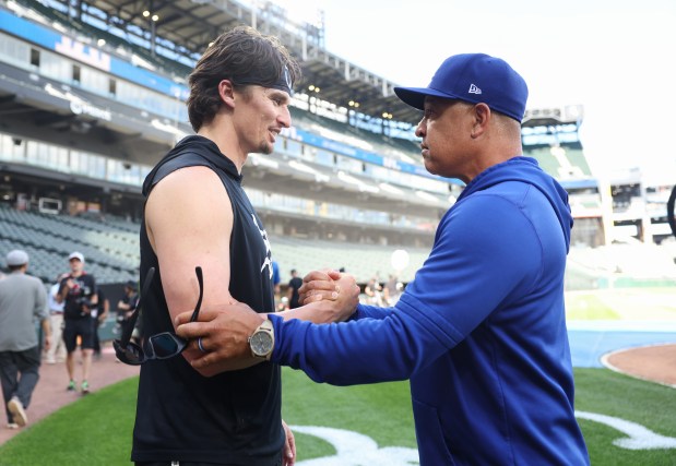 White Sox pitcher Davis Martin, left, and Dodgers manager Dave Roberts talk before a game at Rate Field on June 12, 2026, in Chicago. (John J. Kim/Chicago Tribune)