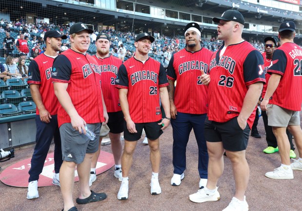 Chicago Bears rookie players, including first round draft pick Dillon Thieneman, center, attend a White Sox-Dodgers game at Rate Field on June 12, 2026, in Chicago. (John J. Kim/Chicago Tribune)