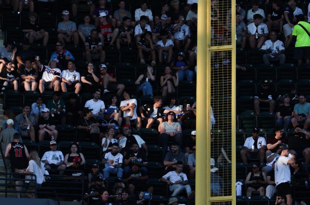 Fans are illuminated by the setting sun in the third inning of a White Sox-Dodgers game on June 12, 2026, at Rate Field. (John J. Kim/Chicago Tribune)