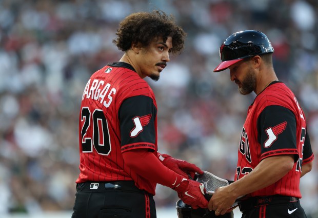 White Sox third baseman Miguel Vargas hands off his batting equipment after hitting a single in the third inning against the Dodgers on June 12, 2026, at Rate Field. (John J. Kim/Chicago Tribune)