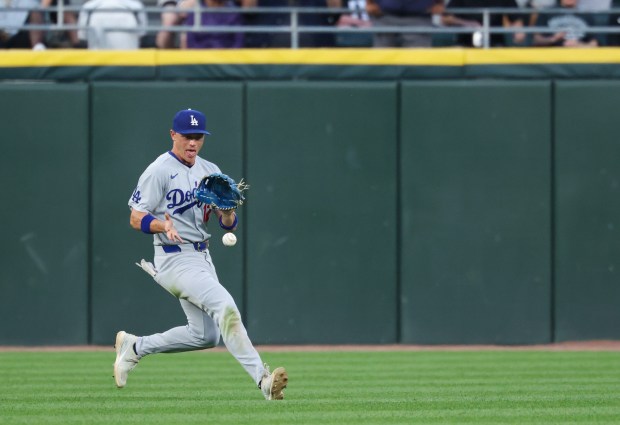 Dodgers left fielder Alex Call chases a ball hit by White Sox catcher Drew Romo for a single in the fifth inning on June 12, 2026, at Rate Field. (John J. Kim/Chicago Tribune)