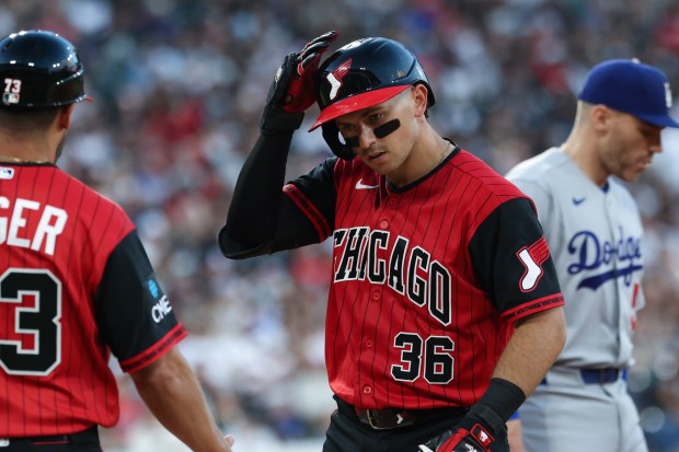 White Sox catcher Drew Romo taps his helmet after hitting a single against the Dodgers in the fifth inning on June 12, 2026, at Rate Field. (John J. Kim/Chicago Tribune)