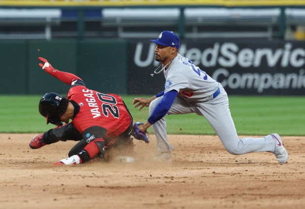 White Sox third baseman Miguel Vargas beats the tag from Dodgers shortstop Mookie Betts for an RBI double in the fifth inning on June 12, 2026, at Rate Field. (John J. Kim/Chicago Tribune)
