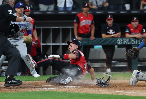 White Sox shortstop Colson Montgomery slides home to score on a two-run single by second baseman Chase Meidroth in the fifth inning against the Dodgers on June 12, 2026, at Rate Field. (John J. Kim/Chicago Tribune)