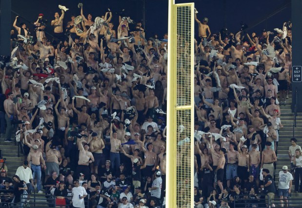 Fans participating in the "tarps off" trend cheer from Section 557 in the upper deck during the eighth inning of a White Sox-Dodgers game on June 12, 2026, at Rate Field. (John J. Kim/Chicago Tribune)