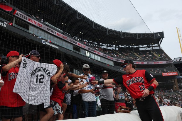 White Sox shortstop Colson Montgomery signs autographs before a game against the Dodgers on June 13, 2026, at Rate Field. (John J. Kim/Chicago Tribune)