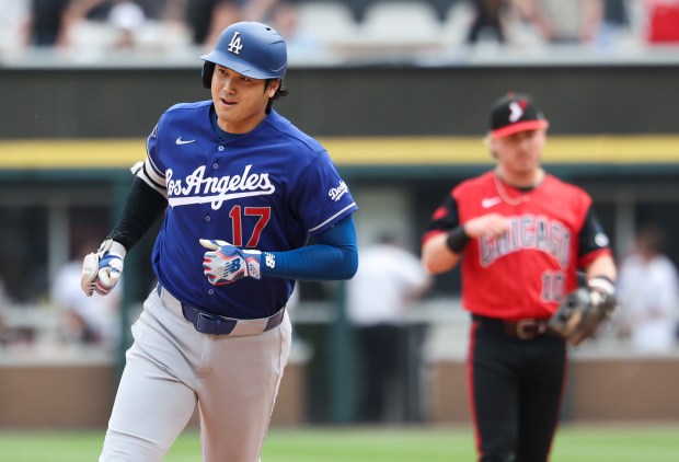 Dodgers designated hitter Shohei Ohtani rounds the bases after hitting a home run in the first inning against the White Sox on June 13, 2026, at Rate Field. (John J. Kim/Chicago Tribune)