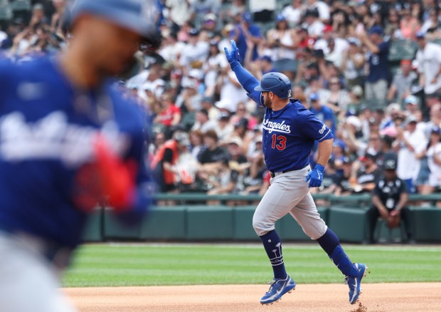 Dodgers third baseman Max Muncy (13) rounds the bases after hitting a two-run home run against the White Sox in the first inning on June 13, 2026, at Rate Field. (John J. Kim/Chicago Tribune)
