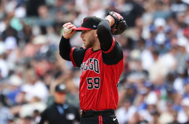 White Sox starter Sean Burke adjusts his cap while on the mound in the third inning against the Dodgers on June 13, 2026, at Rate Field. (John J. Kim/Chicago Tribune)