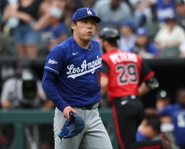 Dodgers starter Yoshinobu Yamamoto exhales as White Sox center fielder Tristan Peters rounds the bases after hitting a home run in the ninth inning on June 13, 2026, at Rate Field. Yamamoto pitched a no-hitter until he gave up the home run. (John J. Kim/Chicago Tribune)