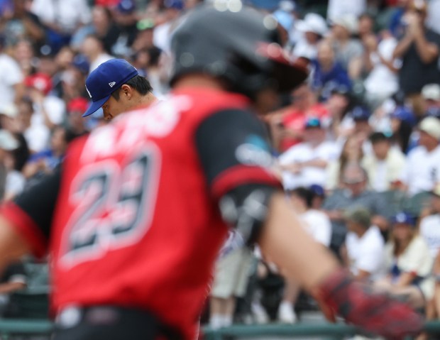 Dodgers starter Yoshinobu Yamamoto stands on the mound as White Sox center fielder Tristan Peters rounds the bases after hitting a home run in the ninth inning on June 13, 2026, at Rate Field. (John J. Kim/Chicago Tribune)