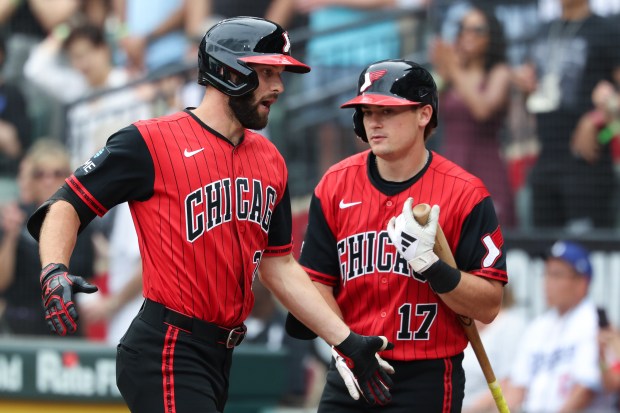 White Sox center fielder Tristan Peters, left, heads to the dugout after hitting a home run in the ninth inning off Dodgers starter Yoshinobu Yamamoto on June 13, 2026, at Rate Field. Yamamoto was throwing a no-hitter until he gave up the home run. (John J. Kim/Chicago Tribune)