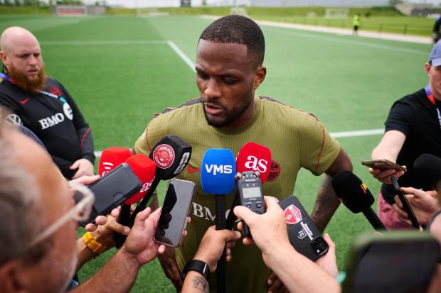 Canada's Cyle Larin speaks to media during a World Cup soccer training session in Toronto, Tuesday, June 9, 2026. (Sammy Kogan/The Canadian Press via AP)