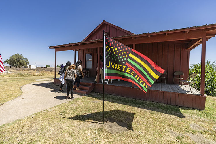 A Juneteenth flag welcomes visitors to Colonel Allensworth State Historic Park. Photo from California State Parks.