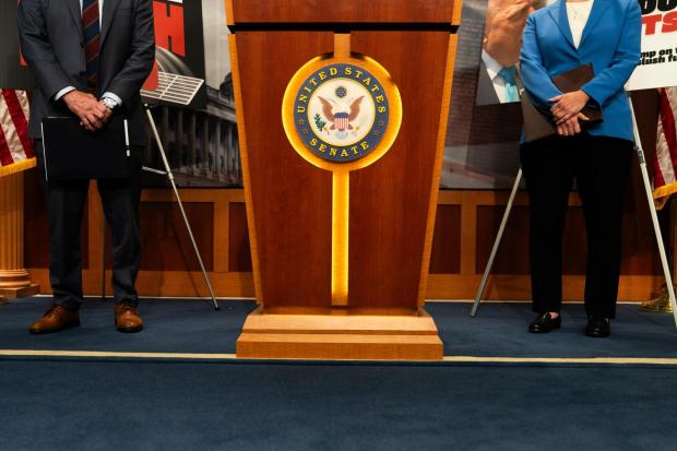 Sen. Mark Kelly, D-Ariz., and Sen. Elissa Slotkin, D-Mich., attend a news conference.