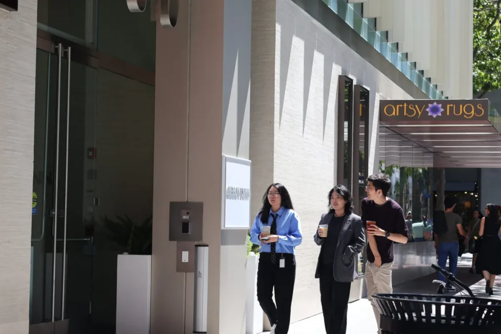 People walking by a Hotel