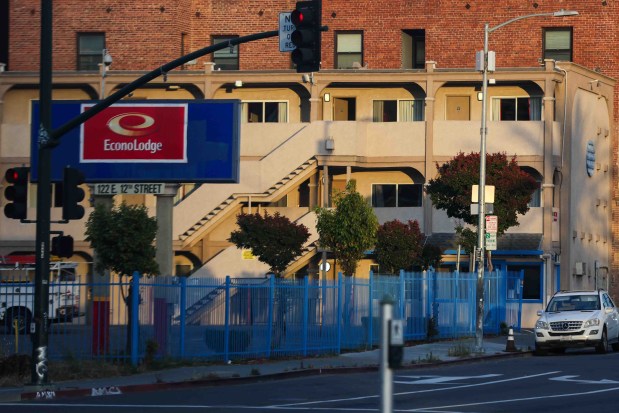 A view of the Econo Lodge hotel at the corner of East 12th Street and 1st Avenue in Oakland, Calif., on Tuesday, May 12, 2026. (Ray Chavez/Bay Area News Group)