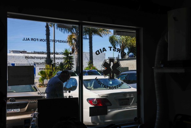 A person walks through the International Plaza, a former motel converted into commercial spaces at the corner of International Boulevard and 17th Avenue in Oakland, Calif., on Friday, April 17, 2026. (Ray Chavez/Bay Area News Group)