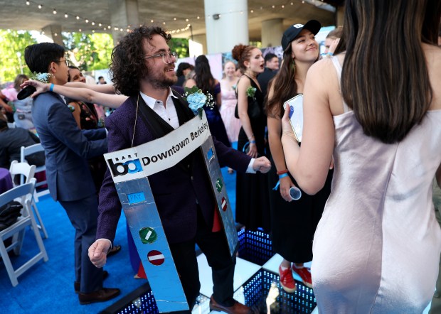 Taylor Waddell, of Berkeley, dances with friends during the BART Prom at the Rockridge BART station Oakland, Calif., on Saturday, June 6, 2026. The first-ever event had an 1980's and under-the-sea theme and sold out. (Jane Tyska/Bay Area News Group)