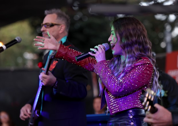 Michelle Moyer performs with the Sixteen Scandals band during the BART Prom at the Rockridge BART station Oakland, Calif., on Saturday, June 6, 2026. The first-ever event had an 1980's and under-the-sea theme and sold out. (Jane Tyska/Bay Area News Group)
