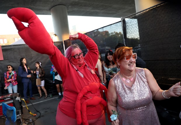 Kelly Slaton and Shiloh Elias, of San Francisco, from left, dance during the BART Prom at the Rockridge BART station Oakland, Calif., on Saturday, June 6, 2026. The first-ever event had an 1980's and under-the-sea theme and sold out. (Jane Tyska/Bay Area News Group)