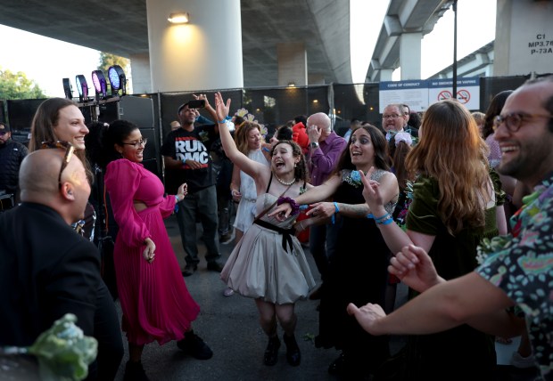 People dance to the Sixteen Scandals band during the BART Prom at the Rockridge BART station Oakland, Calif., on Saturday, June 6, 2026. The first-ever event had an 1980's and under-the-sea theme and sold out. (Jane Tyska/Bay Area News Group)
