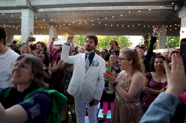 People cheer during the BART Prom at the Rockridge BART station Oakland, Calif., on Saturday, June 6, 2026. The first-ever event had an 1980's and under-the-sea theme and sold out. (Jane Tyska/Bay Area News Group)