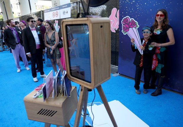 Ziggy Oelverder, 10, and his mom Beth, of Oakland, have their photo taken during the BART Prom the Rockridge BART station Oakland, Calif., on Saturday, June 6, 2026. The first-ever event had an 1980's and under-the-sea theme and sold out. (Jane Tyska/Bay Area News Group)