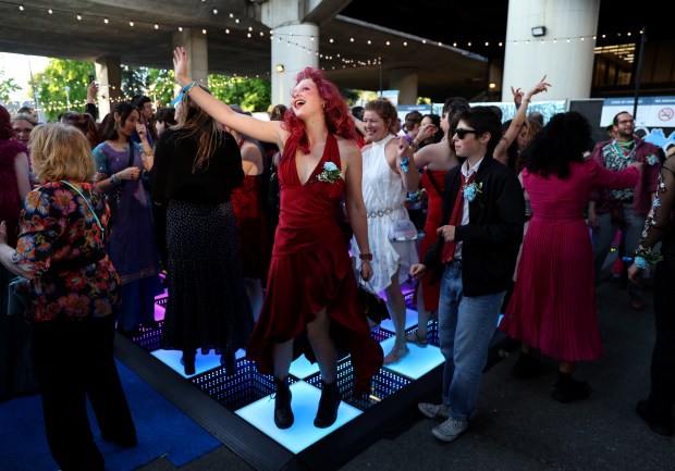 Avalon Wood, of Oakland, center, dances during the BART Prom at the Rockridge BART station Oakland, Calif., on Saturday, June 6, 2026. The first-ever event had an 1980's and under-the-sea theme and sold out. (Jane Tyska/Bay Area News Group)