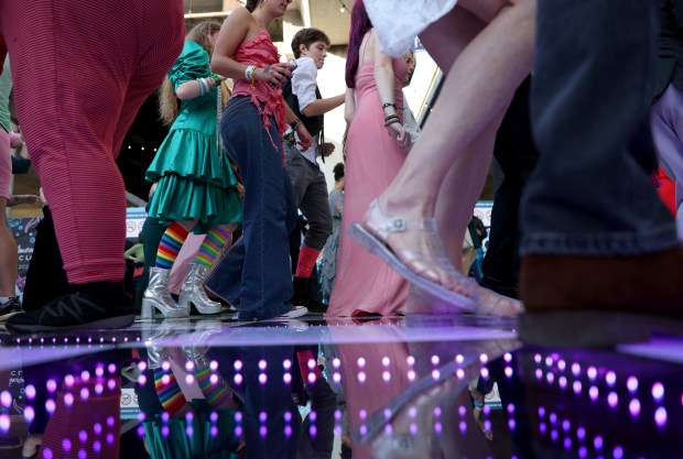 People dance to the tunes of D.J. Billy Vidal during the BART Prom at the Rockridge BART station Oakland, Calif., on Saturday, June 6, 2026. The first-ever event had an 1980's and under-the-sea theme and sold out. (Jane Tyska/Bay Area News Group)