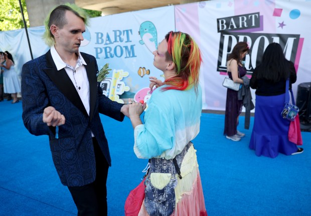 Michael Nowen, and Kit Levy, of Oakland, dance during the BART Prom at the Rockridge BART station Oakland, Calif., on Saturday, June 6, 2026. The first-ever event had an 1980's and under-the-sea theme and sold out. (Jane Tyska/Bay Area News Group)