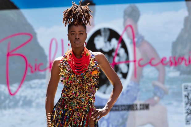 A model wearing a design from Brick House Accessories walks the runway during a Bay Area Black Fashion Expo show to celebrate Juneteenth, Friday, June 19, 2026 in Emeryville, Calif. (D. Ross Cameron for the Bay Area News Group)