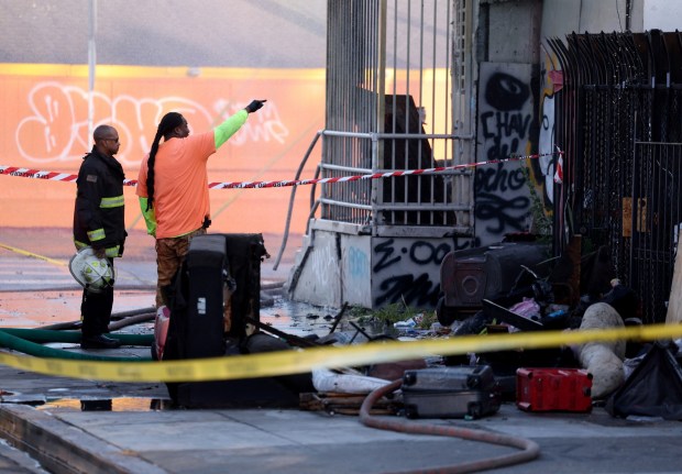 Oakland firefighters and city personnel respond to a two-alarm fire on International Boulevard at 90th Avenue in Oakland, Calif., on Saturday, June 13, 2026. (Jane Tyska/Bay Area News Group)
