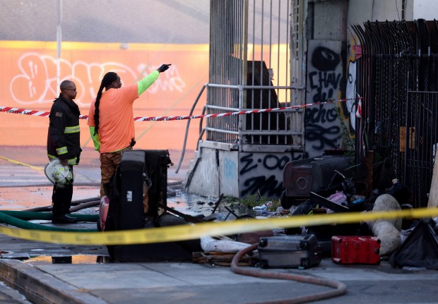 Oakland firefighters and city personnel respond to a two-alarm fire on International Boulevard at 90th Avenue in Oakland, Calif., on Saturday, June 13, 2026. (Jane Tyska/Bay Area News Group)